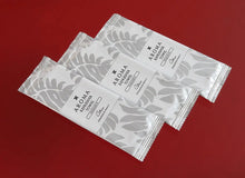 Load image into Gallery viewer, silver Xceed Towels refresher towel on red background