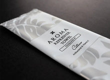 Load image into Gallery viewer, silver Xceed Towels refresher towel on black background