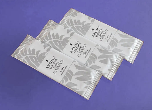Silver Xceed Towels refresher towel on purple background