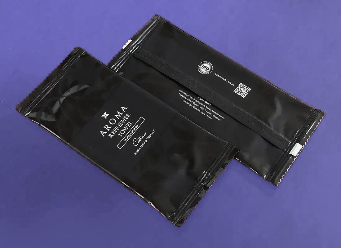 Aroma 60 Black Xceed Towels refresher towel on purple background, back and front