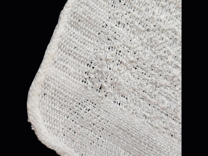 Close up of the Cotton 8 Oshibori towel's cotton weave and hemmed edge