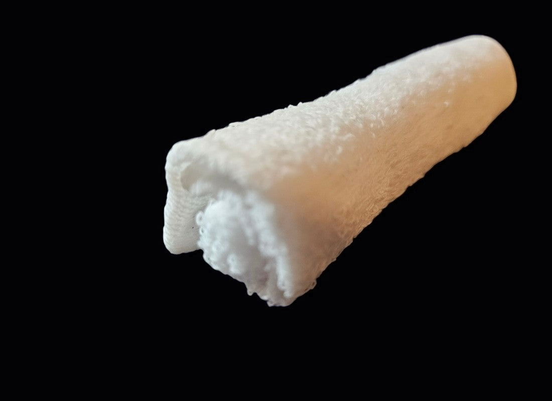 Rolled Cotton 8 Oshibori towel without packaging on black background