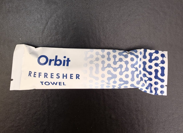 White wrapper with blue print for a refresher towel brand